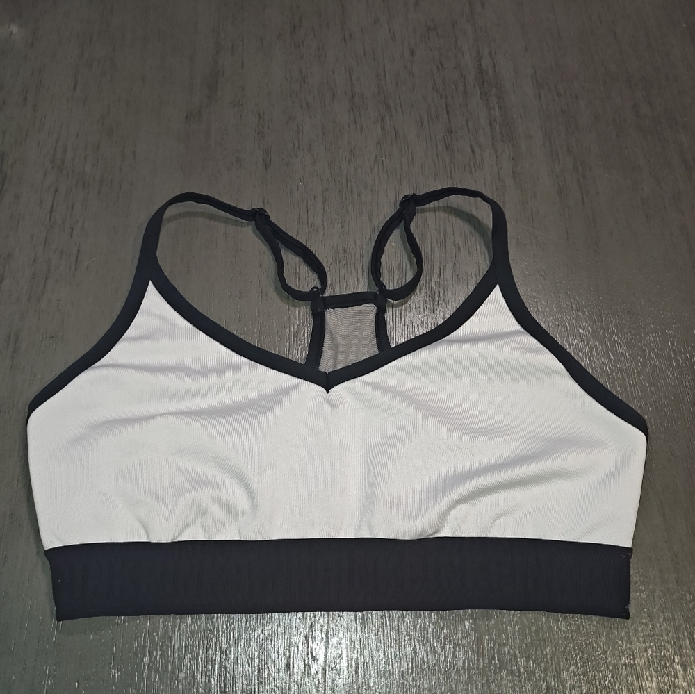 PINK by Victoria's Secret Woman's Ultimate Lightly Lined sports bra in white...